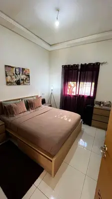 a bedroom with a large bed in a room at Magic house in Mansouria