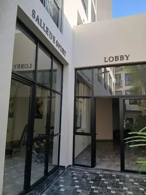 an entrance to a building with glass doors at BeauLiving Park in Casablanca
