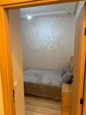 a bedroom with a bed in a room at Bouznika in Bouznika