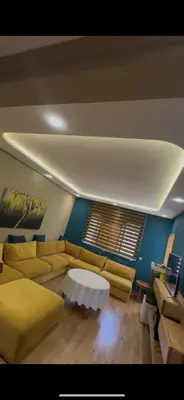 a living room with a couch and a table at oceon vue rabat center in Rabat