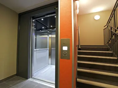 a hallway with a glass door and a staircase at oceon vue rabat center in Rabat