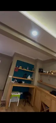 a room with a desk and a table in a room at oceon vue rabat center in Rabat
