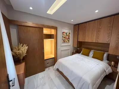 a bedroom with a white bed and a window at Le studio Chic in Casablanca