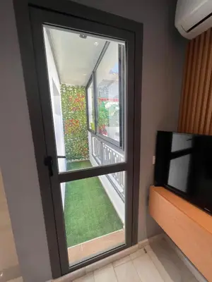 a window in a room with a television at Le studio Chic in Casablanca