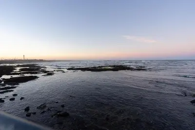 a view of the ocean from the beach at sunset at Luxury Studio near to H2M Area in Casablanca