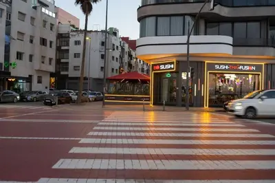 a city street with cars parked in front of a store at Luxury Studio near to H2M Area in Casablanca