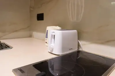 a white toaster sitting on top of a kitchen counter at Luxury Studio near to H2M Area in Casablanca