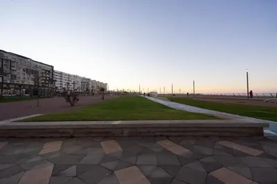a park in a city with buildings and the ocean at Luxury Studio near to H2M Area in Casablanca