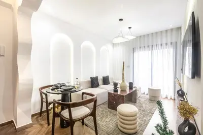 a living room with a table and a couch at Luxurious studio with Jacuzzi in Casablanca in Casablanca