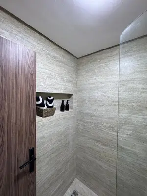 a bathroom with a shower with a glass door at Luxurious studio with Jacuzzi in Casablanca in Casablanca