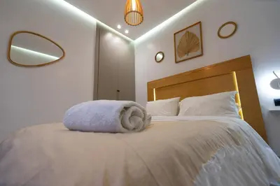 a bedroom with a bed with a towel on it at Luxury Studio near to hassan 2 in Casablanca