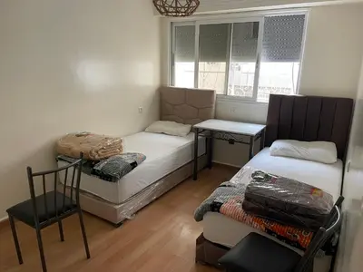 a small room with a bed and a window at Casablanca B& in Casablanca