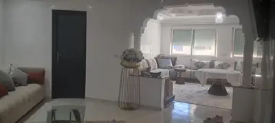 a living room with a couch and a table at Appartement près de la corniche in Casablanca
