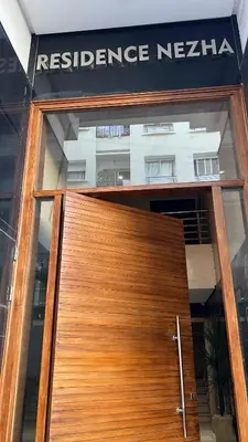 a wooden door to aresurance agency building at Love appartement1 in Casablanca