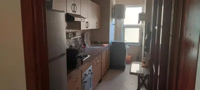 a kitchen with a white refrigerator and a sink at Lina Cozy City Apartment in Casablanca