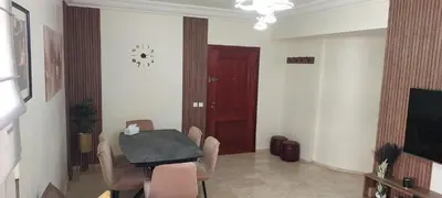 a dining room with a table and chairs and a door at Lina Cozy City Apartment in Casablanca