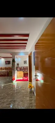 a living room with a couch and a bed in a room at Appartement meublé à louer in Rabat