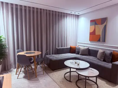 a living room with a couch and two tables at Studio luxe Centre ville in Casablanca