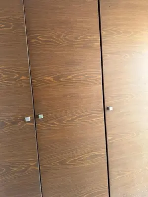 a pair of brown wooden cabinets with metal doors at Good vibes in Casablanca