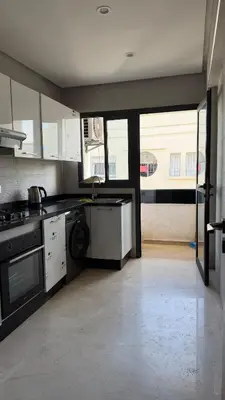 a kitchen with black and white appliances in a room at Good vibes in Casablanca
