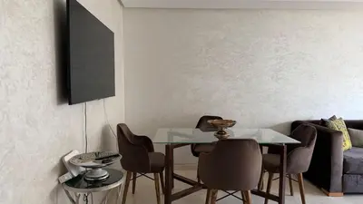 a dining room with a glass table and chairs at Good vibes in Casablanca