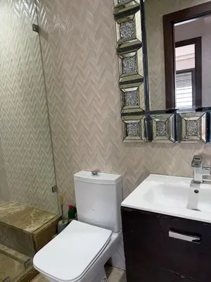 a bathroom with a toilet and a sink and a mirror at Good vibes in Casablanca