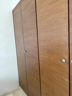 a large wooden cabinet in a room at Good vibes in Casablanca