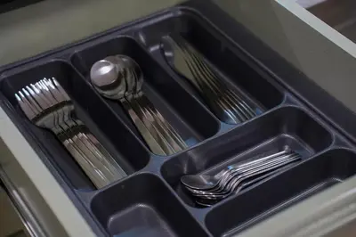 a black tray with utensils in a drawer at Luxury 3 Suites - Av Annakhil - 5 Min to Stadium in Rabat