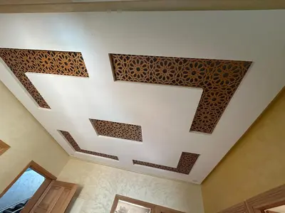 a room with a ceiling with a design on it at Skhirat apartment in Skhirat