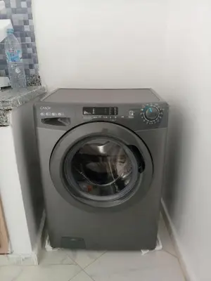 a washing machine in a corner of a room at Comfortable Escape Stylish Apartment Quiet Residence in Oulad Kerroum