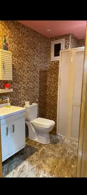 a bathroom with a toilet and a sink at Appartement à louer in Rabat