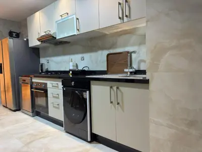 a kitchen with a sink and a dishwasher at Furnished and bright apartment in Rabat