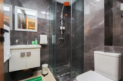 a bathroom with a shower and a toilet and a sink at New and bright stylish studio in Casablanca