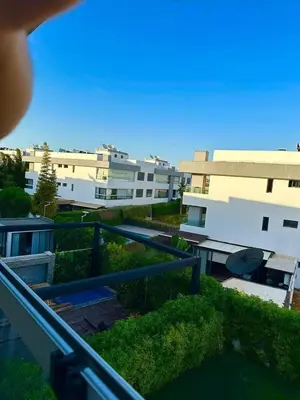 a view of a building from a balcony at Appartement meublé à louer à dar bouazza in Tamaris