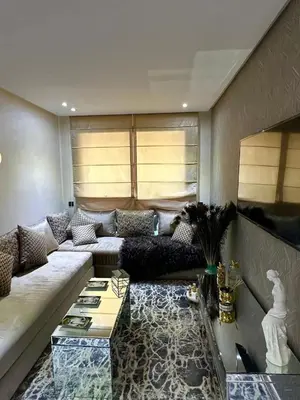 a living room with a couch and a table at luxury furnished apartment for rent in Tamaris