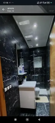 a bathroom with a sink and a toilet at Wifak temara in Temara