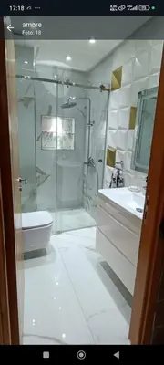 a bathroom with a shower and a toilet and a sink at Wifak temara in Temara