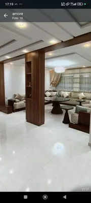 a large living room with couches and a table at Wifak temara in Temara
