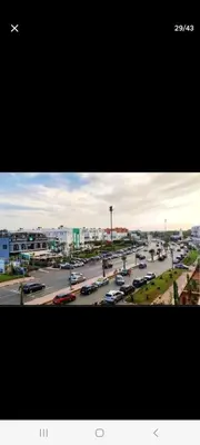a city with cars parked in a parking lot at Apparemment in Mansouria