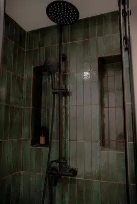 a shower in a bathroom with green tile at AnfaSuites - Résidence Pashmina - Maarif - Parking in Maarif