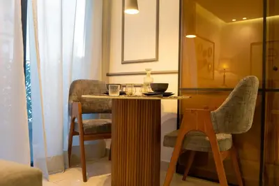 a small table and two chairs in a room at Luxury Studio Corniche near H2 Area in Casablanca