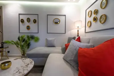 a living room with a couch and a table at Luxury Studio Corniche near H2 Area in Casablanca