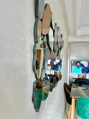 a rack of mirrors hanging on a wall at Chic 2-bedroom apartment, pool and beach 5 min away in Mohammedia