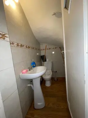 a bathroom with a sink and a toilet at Appartement a louer par jours in Temara