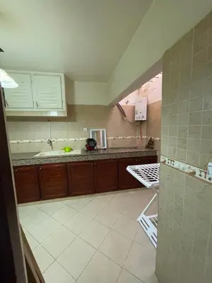 a kitchen with a sink and a counter top at Appartement a louer par jours in Temara