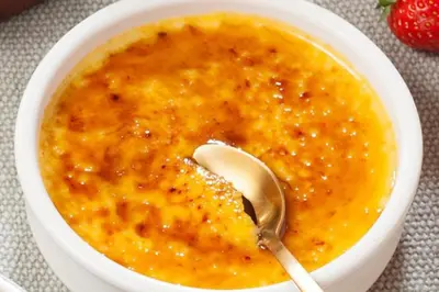 a white bowl of soup with a spoon in it at nouaceur prestige in Bouskoura