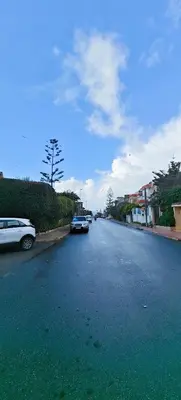 a street with two cars parked on the side of the road at \u9526\u9ca4JinLi 28villa in Casablanca
