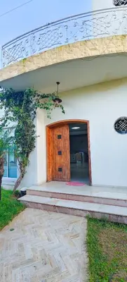 a building with a wooden door and a staircase at \u9526\u9ca4JinLi 28villa in Casablanca