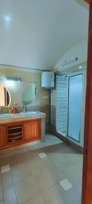 a kitchen with a sink and two mirrors at \u9526\u9ca4JinLi 28villa in Casablanca