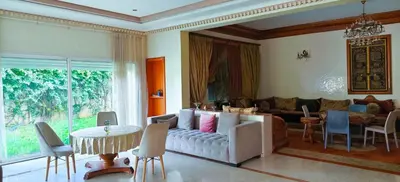 a living room with a couch and a table at \u9526\u9ca4JinLi 28villa in Casablanca